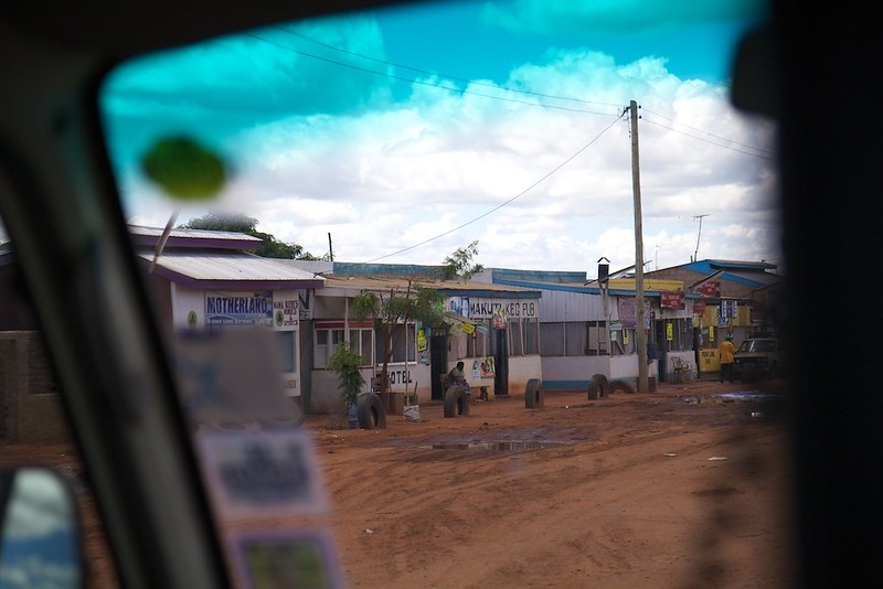 View of buildings in Kenya through a car windscreen